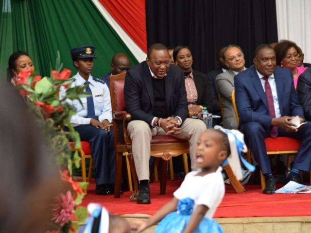 Kenya's First Female Aide-de-Camp RN Kamui Accompanies President Uhuru to a Public Event